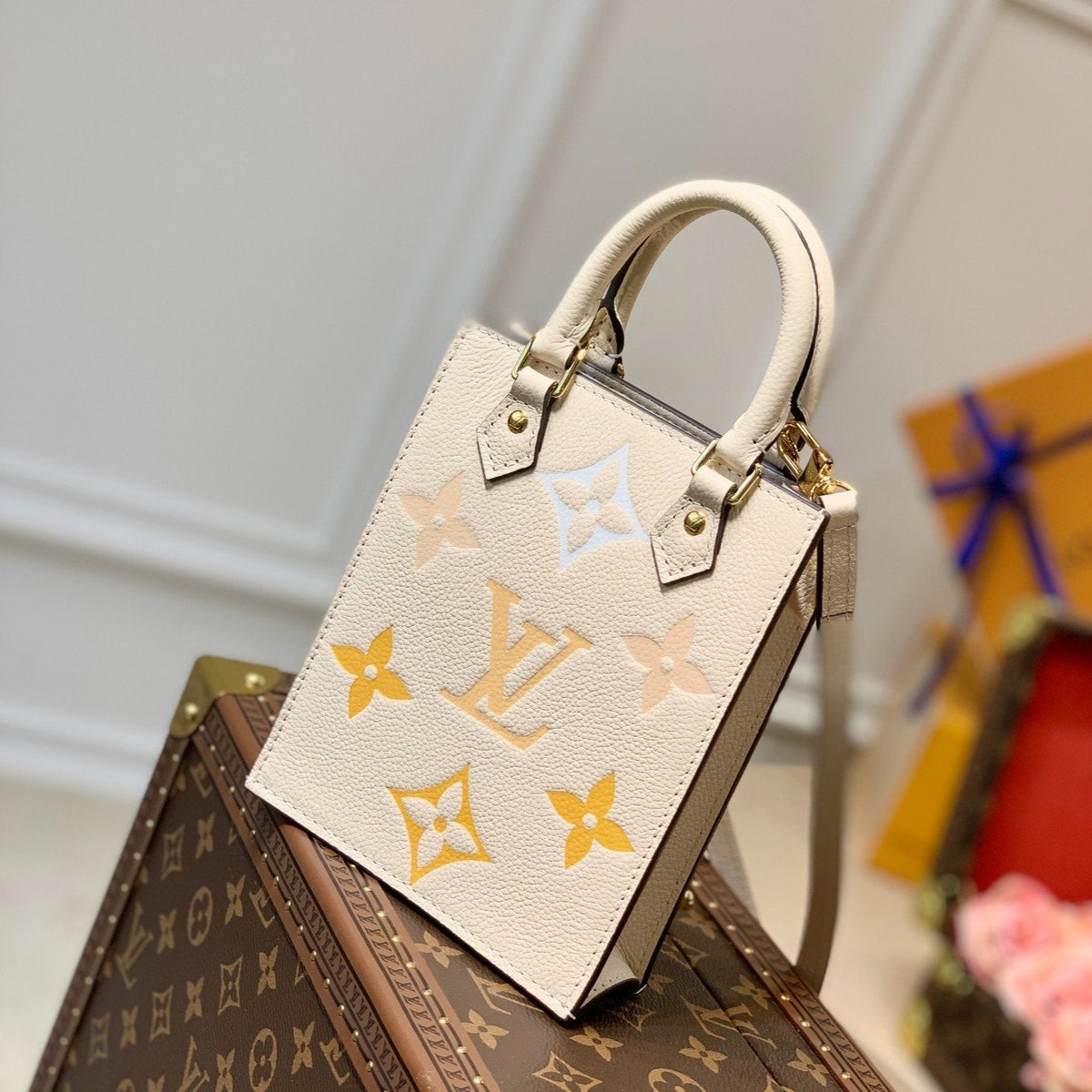 L*V PETIT SAC PLAT CREAM MONOGRAM EMPREINTE COWHIDE LEATHER