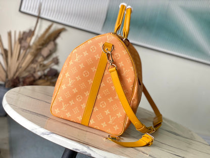 KEEPALL BANDOULI_RE 55 IN ORANGE MONOGRAM HERITAGE CANVAS