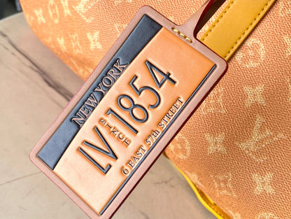 KEEPALL BANDOULI_RE 55 IN ORANGE MONOGRAM HERITAGE CANVAS