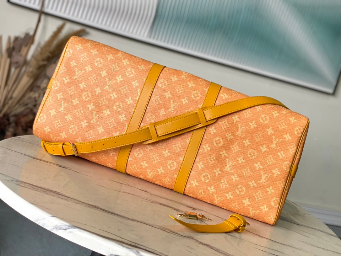 KEEPALL BANDOULI_RE 55 IN ORANGE MONOGRAM HERITAGE CANVAS