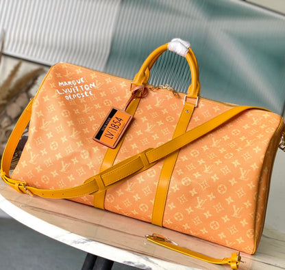 KEEPALL BANDOULI_RE 55 IN ORANGE MONOGRAM HERITAGE CANVAS